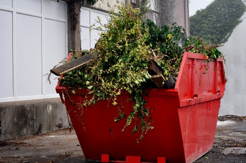 Recycling materials being loaded into an enclosed skip